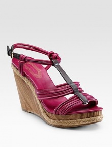 City-bright strappy leather with knot detail and wood wedge. Wedge with rope detail, 4 (101.6mm) Platform, 1¼ (31.75mm) Adjustable ankle strap Leather lining and sole Padded insole Imported City-bright strappy leather with knot detail and wood wedge. Wedge with rope detail, 4 (101.6mm) Platform, 1¼ (31.75mm) Adjustable ankle strap Leather lining and sole Padded insole Imported