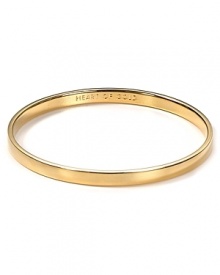 Understated alone and statement making when stacked. kate spade new york's engraved gold-plated bangle gives every look the Midas touch.