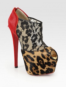 Stand out in a crowd with this leopard-print ankle boot rendered in lush calf hair and semi-sheer lace. Calf hair-covered heel, 6¼ (155mm)Hidden platform, 2½ (65mm)Compares to a 3¾ heel (95mm)Calf hair and lace upper with leather trimPeep toeBack zipLeather liningSignature red leather solePadded insoleMade in Italy Stand out in a crowd with this leopard-print ankle boot rendered in lush calf hair and semi-sheer lace. Calf hair-covered heel, 6¼ (155mm)Hidden platform, 2½ (65mm)Compares to a 3¾ heel (95mm)Calf hair and lace upper with leather trimPeep toeBack zipLeather liningSignature red leather solePadded insoleMade in Italy