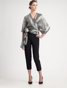 Metallic, silk blend, rendered in a wrap front kimono style with a dramatic, sculptural side tie.Surplice necklineWide three-quarter kimono sleevesWrap front with side tie74% viscose/26% silkDry cleanMade in Italy of imported fabricModel shown is 5'10 (177cm) wearing US size 4. Metallic, silk blend, rendered in a wrap front kimono style with a dramatic, sculptural side tie.Surplice necklineWide three-quarter kimono sleevesWrap front with side tie74% viscose/26% silkDry cleanMade in Italy of imported fabricModel shown is 5'10 (177cm) wearing US size 4.
