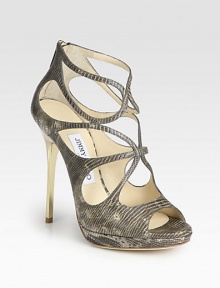 Strappy platform silhouette of lizard-embossed leather with a sleek goldtone heel. Metal heel, 4¾ (120mm)Covered platform, ½ (15mm)Compares to a 4¼ heel, (110mm)Lizard-embossed leather upperBack zipLeather lining and solePadded insoleMade in ItalyOUR FIT MODEL RECOMMENDS ordering one half size up as this style runs small. Strappy platform silhouette of lizard-embossed leather with a sleek goldtone heel. Metal heel, 4¾ (120mm)Covered platform, ½ (15mm)Compares to a 4¼ heel, (110mm)Lizard-embossed leather upperBack zipLeather lining and solePadded insoleMade in ItalyOUR FIT MODEL RECOMMENDS ordering one half size up as this style runs small.
