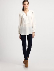 An elegant design cut from gorgeous silk georgette finished with delicate pleats at the bodice and shoulders.RoundneckButton frontGathered sleevesShirttail hemBack box pleatAbout 27 from shoulder to hemSilkDry cleanImportedModel shown is 5'9½ (176cm) wearing US size Small. An elegant design cut from gorgeous silk georgette finished with delicate pleats at the bodice and shoulders.RoundneckButton frontGathered sleevesShirttail hemBack box pleatAbout 27 from shoulder to hemSilkDry cleanImportedModel shown is 5'9½ (176cm) wearing US size Small.