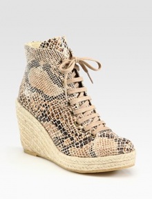 Classic ankle-grazing silhouette modernized by a snake-print faux leather upper, lace-up front and an espadrille wedge. Braided hemp wedge, 4 (100mm)Braided hemp platform, 1 (25mm)Compares to a 3 heel (75mm)Snake-print faux leather and burlap upperRubber solePadded insoleMade in SpainOUR FIT MODEL RECOMMENDS ordering true whole size; ½ sizes should order the next whole size up. Classic ankle-grazing silhouette modernized by a snake-print faux leather upper, lace-up front and an espadrille wedge. Braided hemp wedge, 4 (100mm)Braided hemp platform, 1 (25mm)Compares to a 3 heel (75mm)Snake-print faux leather and burlap upperRubber solePadded insoleMade in SpainOUR FIT MODEL RECOMMENDS ordering true whole size; ½ sizes should order the next whole size up.