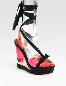 Blooming florals in berry hues transform this satin design ,with a strong espadrille wedge and solid ribbon ties. Satin-covered wedge, 5½ (140mm)Covered platform, 1½ (40mm)Compares to a 4 heel (100mm)Satin upper with grosgrain ribbon trimSatin liningSignature red leather solePadded insoleMade in Spain Blooming florals in berry hues transform this satin design ,with a strong espadrille wedge and solid ribbon ties. Satin-covered wedge, 5½ (140mm)Covered platform, 1½ (40mm)Compares to a 4 heel (100mm)Satin upper with grosgrain ribbon trimSatin liningSignature red leather solePadded insoleMade in Spain