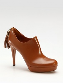 Smooth leather ankle boots with bamboo and tassel details at the heel. Self-covered heel, 3½ (90mm) Platform, ¾ (20mm) Compares to a 2¾ heel (70mm) Shaft, 2 Bamboo tassel detail Back zip Leather lining and sole Padded insole Made in Italy Smooth leather ankle boots with bamboo and tassel details at the heel. Self-covered heel, 3½ (90mm) Platform, ¾ (20mm) Compares to a 2¾ heel (70mm) Shaft, 2 Bamboo tassel detail Back zip Leather lining and sole Padded insole Made in Italy