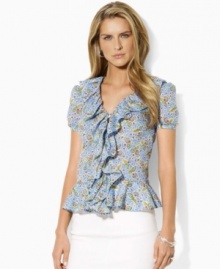 The ethereal Lauren Jeans Co. blouse is designed in breezy, slightly sheer cotton with frothy ruffles and a delicate floral pattern for modern romance. The ethereal Lauren Jeans Co. blouse is designed in breezy, slightly sheer cotton with frothy ruffles and a delicate floral pattern for modern romance.