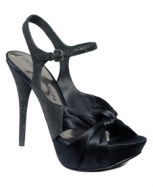 Knots can be so beautiful. With its satin and glitter upper and knotted toe strap, GUESS by Marciano's Carmo2 platform evening sandals will show you why. Knots can be so beautiful. With its satin and glitter upper and knotted toe strap, GUESS by Marciano's Carmo2 platform evening sandals will show you why.
