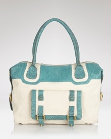Canvas and leather make a cool colorblocked statement on this roomy tote from Treesje. Practical and perfectly on-trend, turns out two tones are better than one. Canvas and leather make a cool colorblocked statement on this roomy tote from Treesje. Practical and perfectly on-trend, turns out two tones are better than one.