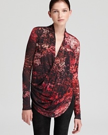 A fiery print adorns this wrap-style Helmut Lang tunic with high-low hemline and flattering draping. A fiery print adorns this wrap-style Helmut Lang tunic with high-low hemline and flattering draping.