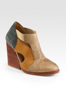 A chunky, stacked heel lifts this design of paneled leather and suede, topped with peek-a-boo cutouts. Stacked heel, 4 (100mm)Leather and suede upper with elasticized strapsPull-on styleLeather lining and solePadded insoleImported A chunky, stacked heel lifts this design of paneled leather and suede, topped with peek-a-boo cutouts. Stacked heel, 4 (100mm)Leather and suede upper with elasticized strapsPull-on styleLeather lining and solePadded insoleImported