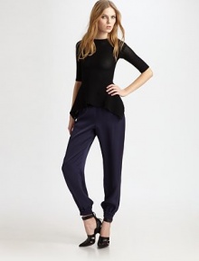 Knit mesh goes for bold in this peplum-pretty silhouette styled with a skin-baring cut-away back.Jewel necklineElbow sleevesFront gathered peplumButton-down back in three split panelsAbout 32 from shoulder to hem86% viscose/14% LycraDry cleanImportedModel shown is 5'10 (177cm) wearing US size Small. Knit mesh goes for bold in this peplum-pretty silhouette styled with a skin-baring cut-away back.Jewel necklineElbow sleevesFront gathered peplumButton-down back in three split panelsAbout 32 from shoulder to hem86% viscose/14% LycraDry cleanImportedModel shown is 5'10 (177cm) wearing US size Small.