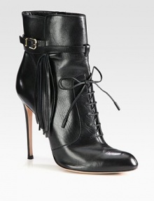 Channel biker-chic vibes wearing this leather ankle boot, with fringe detailing and an adjustable buckle strap. Self-covered heel, 4 (100mm)Leather upper with adjustable buckle strapLeather lining and solePadded insoleMade in Italy Channel biker-chic vibes wearing this leather ankle boot, with fringe detailing and an adjustable buckle strap. Self-covered heel, 4 (100mm)Leather upper with adjustable buckle strapLeather lining and solePadded insoleMade in Italy