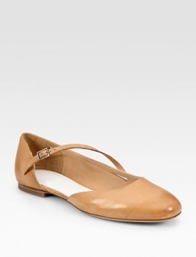 Pristine leather flat in a low-cut design with a unique, asymmetrical buckle strap. Leather upperLeather lining and solePadded insoleMade in ItalyOUR FIT MODEL RECOMMENDS ordering true size. 