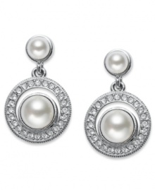 Polished perfection. A polished simulated pearl (6 mm) with genuine mother-of-pearl coating is adorned with round-cut crystal accents on Eliot Danori's elegant drop earrings. Set in rhodium-plated mixed metal. Approximate drop: 1/2 inch. Polished perfection. A polished simulated pearl (6 mm) with genuine mother-of-pearl coating is adorned with round-cut crystal accents on Eliot Danori's elegant drop earrings. Set in rhodium-plated mixed metal. Approximate drop: 1/2 inch.
