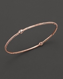 From the Rosé collection, a two-diamond hammered bangle. Designed by Ippolita. From the Rosé collection, a two-diamond hammered bangle. Designed by Ippolita.