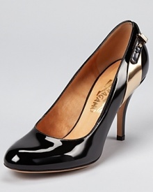 A gold-tone metal plate adds a hit of hardware to Salvatore Ferragamo's Benny pumps, a glossy style in classic black.