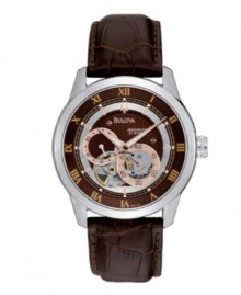 Rich, saturated hues combine on this self-winding watch by Bulova. Brown croc-embossed leather strap and round stainless steel case. Brown dial with textured inner dial features silver tone inner ring, gold tone Roman numerals at markers, rose-gold tone stick indices, rose-gold tone and silver tone subdials and logo. Automatic movement. Water resistant to 30 meters. Three-year limited warranty. Rich, saturated hues combine on this self-winding watch by Bulova. Brown croc-embossed leather strap and round stainless steel case. Brown dial with textured inner dial features silver tone inner ring, gold tone Roman numerals at markers, rose-gold tone stick indices, rose-gold tone and silver tone subdials and logo. Automatic movement. Water resistant to 30 meters. Three-year limited warranty.