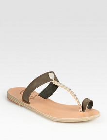 Embrace your inner goddess with this Grecian-inspired leather design, topped with a braided metallic leather t-strap and finished with a toe ring. Leather and metallic leather upperLeather lining and soleMade in GreeceOUR FIT MODEL RECOMMENDS ordering true whole size; ½ sizes should order the next whole size up. Embrace your inner goddess with this Grecian-inspired leather design, topped with a braided metallic leather t-strap and finished with a toe ring. Leather and metallic leather upperLeather lining and soleMade in GreeceOUR FIT MODEL RECOMMENDS ordering true whole size; ½ sizes should order the next whole size up.
