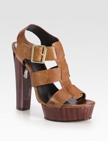 A glossy heel elevates this lust-worthy leather favorite with an adjustable buckle strap. Lacquered heel, 5¼ (130mm)Lacquered island platform, 1¼ (30mm)Compares to a 4 heel (100mm)Leather upperAdjustable ankle strapLeather liningRubber solePadded insoleImported A glossy heel elevates this lust-worthy leather favorite with an adjustable buckle strap. Lacquered heel, 5¼ (130mm)Lacquered island platform, 1¼ (30mm)Compares to a 4 heel (100mm)Leather upperAdjustable ankle strapLeather liningRubber solePadded insoleImported