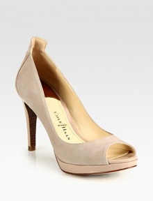 Patent leather heel and platform support an utterly soft suede peep toe design. Patent leather heel, 3 (75mm)Patent leather platform, ½ (15mm)Compares to a 2½ heel (65mm)Suede and patent leather upperLeather lining and solePadded insoleImported
