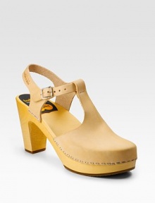 Buttery leather with cutouts and staple trim for an unexpected spin.Wooden heel, 3 (75mm) Wooden platform, ½(15mm) Compares to a 2½ heel (65mm) Leather lining Rubber sole Made in SwedenOUR FIT MODEL RECOMMENDS ordering true whole size; ½ sizes should order the next whole size up. Buttery leather with cutouts and staple trim for an unexpected spin.Wooden heel, 3 (75mm) Wooden platform, ½(15mm) Compares to a 2½ heel (65mm) Leather lining Rubber sole Made in SwedenOUR FIT MODEL RECOMMENDS ordering true whole size; ½ sizes should order the next whole size up.