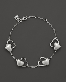 Discover the new Frederique Constant Double Heart Jewelry Collection. Perfectly in line with the Frederique Constant timepiece collection, our jewelry designs effortlessly harmonize the classical with the contemporary for a woman who is elegant, yet spontaneous, sophisticated, and has a strong sense of herself. With an emphasis on exquisite workmanship, we introduce a jewelry collection that incorporates 18K rose gold and sterling silver with diamonds, offering 'easy,' wearable pieces as an everyday luxury. Designed by a lady, for a lady and developed with passion to reflect the aspirations of today's woman in the spirit of what Frederique Constant is famous for: accessible luxury. Sterling silver Double Hearts bracelet with diamond accent and logo crest detailing at clasp. Discover the new Frederique Constant Double Heart Jewelry Collection. Perfectly in line with the Frederique Constant timepiece collection, our jewelry designs effortlessly harmonize the classical with the contemporary for a woman who is elegant, yet spontaneous, sophisticated, and has a strong sense of herself. With an emphasis on exquisite workmanship, we introduce a jewelry collection that incorporates 18K rose gold and sterling silver with diamonds, offering 'easy,' wearable pieces as an everyday luxury. Designed by a lady, for a lady and developed with passion to reflect the aspirations of today's woman in the spirit of what Frederique Constant is famous for: accessible luxury. Sterling silver Double Hearts bracelet with diamond accent and logo crest detailing at clasp.