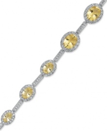 The perfect finishing touch. Eliot Danori's gorgeous all-around bracelet shines with oval-cut cubic zirconia (12-1/2 ct. t.w.) and smaller, round-cut glass crystal. Set in rhodium-plated mixed metal. Approximate length: 7-1/4 inches. The perfect finishing touch. Eliot Danori's gorgeous all-around bracelet shines with oval-cut cubic zirconia (12-1/2 ct. t.w.) and smaller, round-cut glass crystal. Set in rhodium-plated mixed metal. Approximate length: 7-1/4 inches.