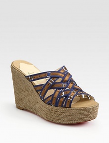 Grounded by a chunky espadrille wedge, printed silk straps take on a buckle-like form. Hemp wedge, 4 (100mm)Hemp platform, 1½ (40mm)Compares to a 2½ heel (65mm)Printed silk upperLeather liningSignature red leather solePadded insoleMade in SpainOUR FIT MODEL RECOMMENDS ordering one half size up as this style runs small. Grounded by a chunky espadrille wedge, printed silk straps take on a buckle-like form. Hemp wedge, 4 (100mm)Hemp platform, 1½ (40mm)Compares to a 2½ heel (65mm)Printed silk upperLeather liningSignature red leather solePadded insoleMade in SpainOUR FIT MODEL RECOMMENDS ordering one half size up as this style runs small.