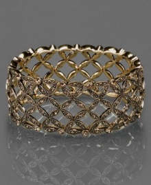 Get a little glitter. This beautiful Monet stretch bracelet features topaz-colored crystal accents set in goldtone mixed metal. Approximate length: 8 inches. Get a little glitter. This beautiful Monet stretch bracelet features topaz-colored crystal accents set in goldtone mixed metal. Approximate length: 8 inches.