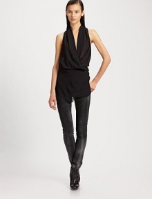 Filmy chiffon draped around the body in a sleeveless cowlneck silhouette, cinched at the waist by a wrap-around beltCrossover cowlneckSleevelessBelted waistAbout 27 from shoulder to hemPolyesterDry cleanMade in USA of imported fabric Filmy chiffon draped around the body in a sleeveless cowlneck silhouette, cinched at the waist by a wrap-around beltCrossover cowlneckSleevelessBelted waistAbout 27 from shoulder to hemPolyesterDry cleanMade in USA of imported fabric