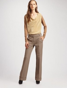 This elegant silhouette is defined with a gathered silk bodice and fine cotton sleeves.Collapsed neckline Long sleeves Slight shirttail hem with side slits About 28 from shoulder to hem Silk bodice; cotton sleeves Dry clean Imported This elegant silhouette is defined with a gathered silk bodice and fine cotton sleeves.Collapsed neckline Long sleeves Slight shirttail hem with side slits About 28 from shoulder to hem Silk bodice; cotton sleeves Dry clean Imported