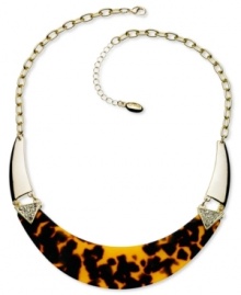 Howl at the moon with this chic crescent-shaped necklace from GUESS. Embellished with sparkling crystal accents and brown tortoise. Crafted in gold tone mixed metal. Approximate length: 16 inches + 2-inch extender. Approximate drop: 1 inch. Howl at the moon with this chic crescent-shaped necklace from GUESS. Embellished with sparkling crystal accents and brown tortoise. Crafted in gold tone mixed metal. Approximate length: 16 inches + 2-inch extender. Approximate drop: 1 inch.