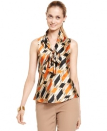 A retro-chic print spices up Nine West's silky shell. Perfect for adding a whimsical -- yet totally stylish -- touch to suits and separates. A retro-chic print spices up Nine West's silky shell. Perfect for adding a whimsical -- yet totally stylish -- touch to suits and separates.