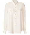 A cool basic perfect for dressing up or down, Josephs soft washed silk top is as chic as it is versatile - Classic collar, long sleeves, buttoned cuffs, button-down front, buttoned flap pockets, gold-toned buttons, slit sides, shirttail hemline, longer back - Loose fit - Wear with leather leggings and booties to work
