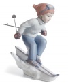 It's time to race in this beautifully crafted porcelain figurine as a little girl hits the slopes with skis and full winter outfit. Handcrafted from Lladro.