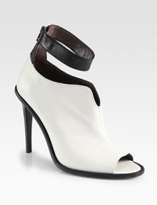 An ankle strap puts a modern spin on this sculpted two-tone leather design, with a sexy open toe and towering heel. Stacked heel, 4¾ (120mm)Leather upperOpen toeBack zipLeather lining and solePadded insoleMade in Italy An ankle strap puts a modern spin on this sculpted two-tone leather design, with a sexy open toe and towering heel. Stacked heel, 4¾ (120mm)Leather upperOpen toeBack zipLeather lining and solePadded insoleMade in Italy
