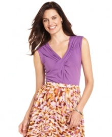 Jones New York's basic top is dressed up with a flattering crisscross detail at the chest and an of-the-moment color. Pair it with a printed skirt for an effortless ensemble. Jones New York's basic top is dressed up with a flattering crisscross detail at the chest and an of-the-moment color. Pair it with a printed skirt for an effortless ensemble.