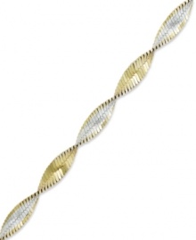 The perfect twist of two-tone metallics. Giani Bernini's versatile bracelet combines links of sterling silver and 24k gold over sterling silver. Approximate length: 7-1/2 inches. The perfect twist of two-tone metallics. Giani Bernini's versatile bracelet combines links of sterling silver and 24k gold over sterling silver. Approximate length: 7-1/2 inches.