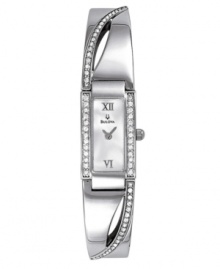 Pure eloquence with a Mother of Pearl dial with stunning crystal accents. Stainless steel silvertone case and bangle. Water resistant to 30 meters. Three-year limited warranty. Pure eloquence with a Mother of Pearl dial with stunning crystal accents. Stainless steel silvertone case and bangle. Water resistant to 30 meters. Three-year limited warranty.