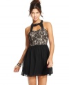 A strong look for a tough chick! Trixxi's party dress features a fierce lace bodice and faux-leather trim.