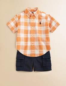 A perfect preppy pairing for the warmer weather, this classic ensemble features a plaid shirt