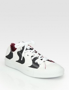 Soft canvas in allover contrasting stripes, concluded by a lace-up front and rubber sole. Canvas upperCanvas liningRubber solePadded insoleImported