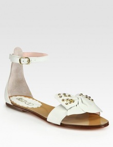 Soft lambskin sandals with an adjustable ankle strap and stud embellishments, fronted by an oversized bow. Studded lambskin upperLeather lining and soleMade in ItalyOUR FIT MODEL RECOMMENDS ordering one half size down as this style runs large. Soft lambskin sandals with an adjustable ankle strap and stud embellishments, fronted by an oversized bow. Studded lambskin upperLeather lining and soleMade in ItalyOUR FIT MODEL RECOMMENDS ordering one half size down as this style runs large.