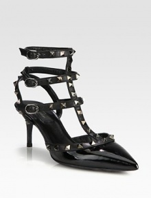 Strong point toe silhouette of patent leather with signature metal studs on adjustable leather straps. Self-covered heel, 2¾ (70mm)Patent leather upper with metal studded leather trimPoint toeThree adjustable ankle strapsLeather lining and solePadded insoleMade in Italy Strong point toe silhouette of patent leather with signature metal studs on adjustable leather straps. Self-covered heel, 2¾ (70mm)Patent leather upper with metal studded leather trimPoint toeThree adjustable ankle strapsLeather lining and solePadded insoleMade in Italy