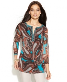 INC crosses the globe for a look of all-out glamour this season! Paisley print and a beaded collar elevate this classic tunic silhouette. INC crosses the globe for a look of all-out glamour this season! Paisley print and a beaded collar elevate this classic tunic silhouette.