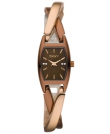 DKNY crafts a twist ending with this chic timepiece. Crafted of brown and rose-gold ion-plated stainless steel twist bracelet and rectangular case. Brown dial features rose-gold tone applied stick indices, crystal accents at three and nine o'clock, logo at twelve o'clock and rose-gold tone two hands. Quartz movement. Water resistant to 30 meters. Two-year warranty. DKNY crafts a twist ending with this chic timepiece. Crafted of brown and rose-gold ion-plated stainless steel twist bracelet and rectangular case. Brown dial features rose-gold tone applied stick indices, crystal accents at three and nine o'clock, logo at twelve o'clock and rose-gold tone two hands. Quartz movement. Water resistant to 30 meters. Two-year warranty.