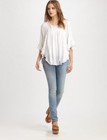 Utter romance in this light and flowy peasant blouse styled with soft ruffles and eyelet trim.Tie-front split V-neckDropped shouldersThree-quarter sleevesGathered bodiceShirttail hemRayonDry cleanImportedModel shown is 5'8½ (174cm) wearing US size Small. Utter romance in this light and flowy peasant blouse styled with soft ruffles and eyelet trim.Tie-front split V-neckDropped shouldersThree-quarter sleevesGathered bodiceShirttail hemRayonDry cleanImportedModel shown is 5'8½ (174cm) wearing US size Small.