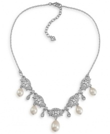 The perfect accessory for your big day. Carolee's lovely bridal necklace stuns with glass pearl drops and sparkling glass and plastic accents. Set in silver tone mixed metal. Approximate length: 16 inches + 2-inch extender. Approximate drops: 5/8 inch.