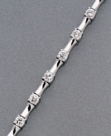 Utterly unique. Links of cylindrical platinum over sterling silver separate gleaming round-cut cubic zirconia (2-1/10 ct. t.w.) in this CRISLU bracelet. Approximate length: 7-1/2 inches. Utterly unique. Links of cylindrical platinum over sterling silver separate gleaming round-cut cubic zirconia (2-1/10 ct. t.w.) in this CRISLU bracelet. Approximate length: 7-1/2 inches.