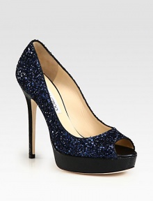Shimmering peep toe silhouette of glittery fabric on an embossed leather platform and heel. Embossed leather heel, 5 (125mm)Embossed leather platform, ¾ (20mm)Compares to a 4¼ heel (110mm)Glitter-coated fabric upperPeep toeLeather lining and solePadded insoleMade in Italy Shimmering peep toe silhouette of glittery fabric on an embossed leather platform and heel. Embossed leather heel, 5 (125mm)Embossed leather platform, ¾ (20mm)Compares to a 4¼ heel (110mm)Glitter-coated fabric upperPeep toeLeather lining and solePadded insoleMade in Italy